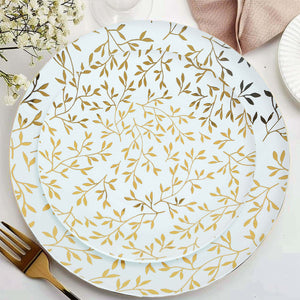 Decorative plates with gold leaf design on a white background.