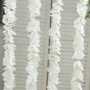 White floral garland hanging decor for events and home styling.