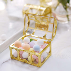 Gold decorative box filled with pastel-colored balls.