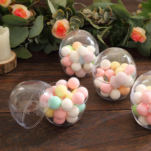 Colorful pastel balls in clear plastic containers on a wooden surface.