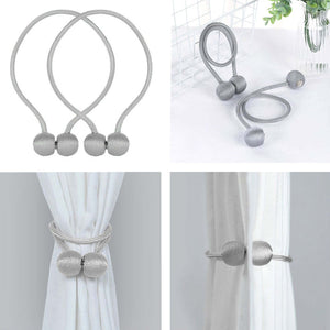 Silver curtain tiebacks with decorative ball ends, set of two.
