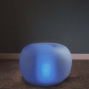 Illuminated blue pouf for modern decor and comfortable seating.