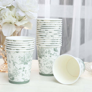 Floral patterned disposable cups stacked with one tipped over