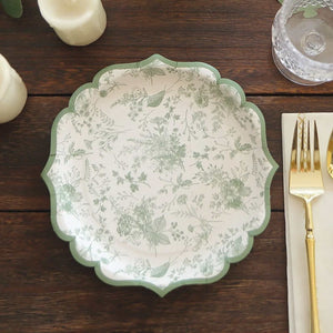 Decorative floral plate with green accents on a wooden table