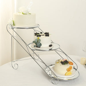 Three-tier cake stand with decorated cakes in elegant presentation.