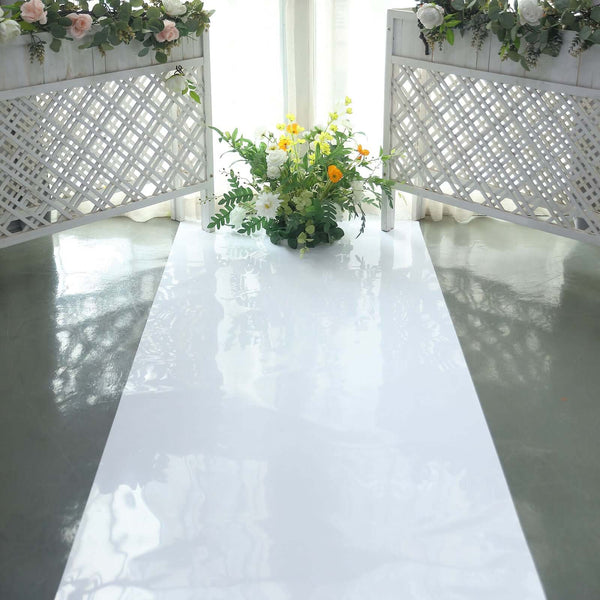 Floral arrangement on a glossy white table with decorative screens in the background.