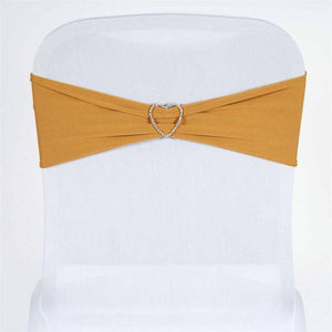 Gold chair sash with heart-shaped rhinestone buckle on a white chair