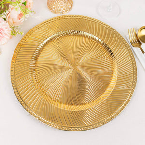 Gold decorative charger plate with intricate swirl design.