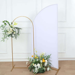 Floral arrangement with gold stand and backdrop in a studio setting.