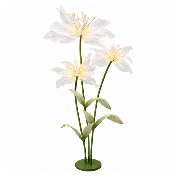Illuminated white flower floor lamp with green stems and leaves