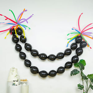 Black balloon garland with colorful accents for festive decor
