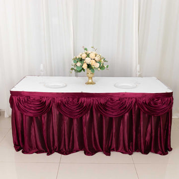 Create a Regal Atmosphere with the Burgundy Pleated Satin Double Drape Table Skirt