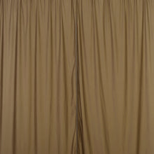 A close up of a pair of taupe scuba polyester curtains on a white background#whtbkgd