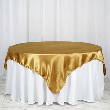 Elevate Your Event Decor with the Gold Seamless Satin Square Tablecloth Overlay