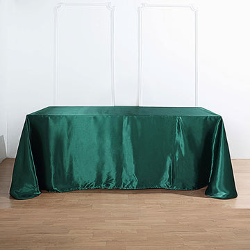Elevate Your Event Decor with the Hunter Emerald Green Satin Seamless Rectangular Tablecloth 90"x132"