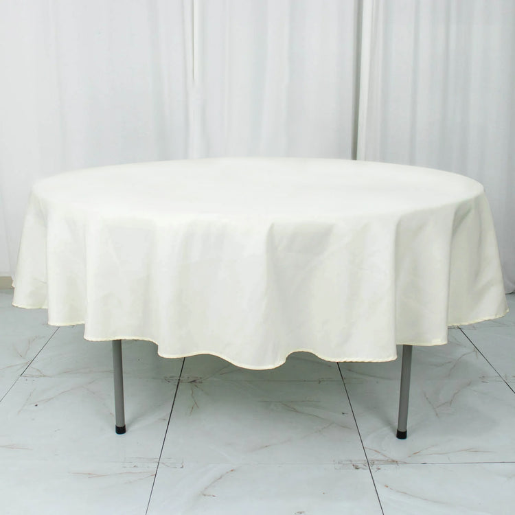 Round 90 Inch Ivory Seamless Premium 190 GSM Polyester Tablecloth