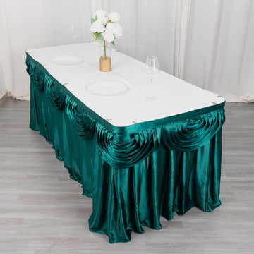 Create a Regal Atmosphere with the Peacock Teal Pleated Satin Double Drape Table Skirt