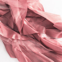 A close up of pink satin & taffeta chair sashes on a white background#whtbkgd