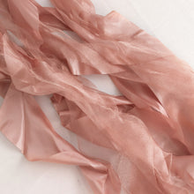 satin & taffeta chair sashes - pink fabric laying on a white surface#whtbkgd