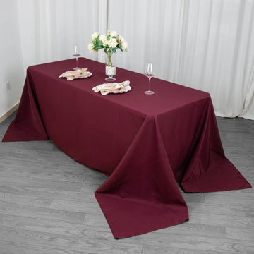 Create a Luxurious Ambiance with the Burgundy Seamless Premium Polyester Rectangular Tablecloth