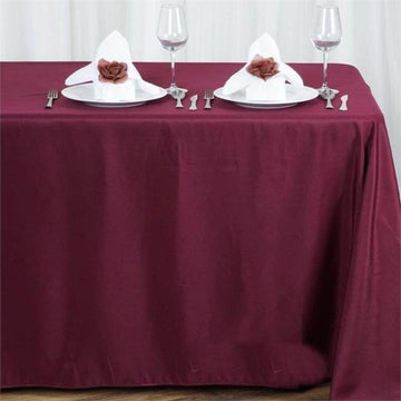 Elevate Your Event Decor with a Burgundy Seamless Polyester Rectangular Tablecloth 90"x156"