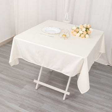 Create an Aura of Opulence with Ivory Premium Scuba Square Tablecloth