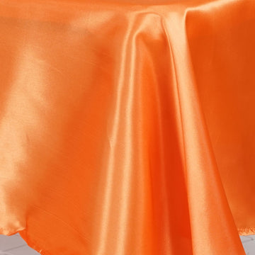 Create a Festive Atmosphere with the Orange Seamless Smooth Satin Tablecloth