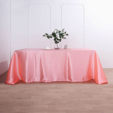 Add Elegance to Your Event with the Coral Red Satin Seamless Rectangular Tablecloth
