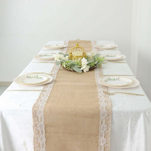 Elegant dining table setting with floral centerpiece and rustic burlap runner.