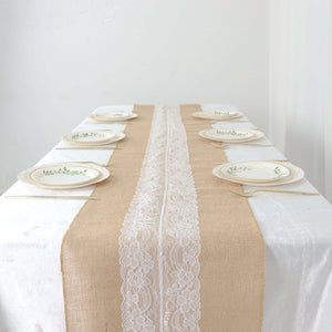 Elegant table setting with rustic burlap runner and decorative plates.