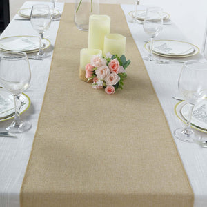 Table runner with candles and flowers on a dining table setting.