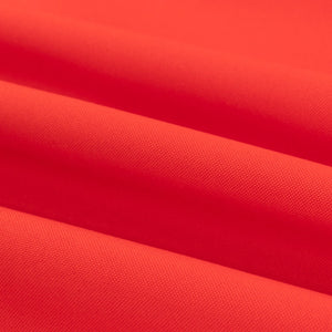 Red fabric texture with soft folds and smooth surface.