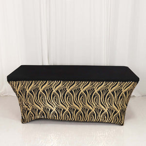 Black and gold wave-patterned table cover on a plain background.