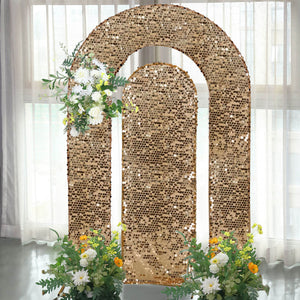 Gold sequin backdrop with floral arrangements for events and photo shoots.