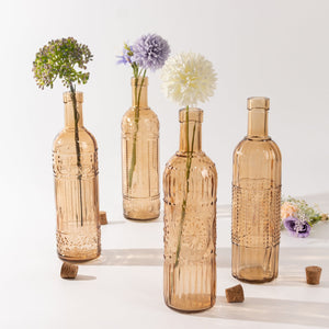 Decorative amber glass bottles with flowers