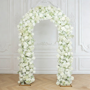 White floral arch with roses and hydrangeas in an elegant wedding backdrop