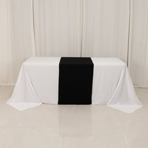 Table with white and black tablecloths for events and gatherings