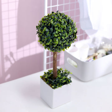 Add a Touch of Serenity with the Green Artificial Boxwood Topiary Ball Tree in White Planter Pot