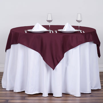 Enhance Your Event with the Burgundy Square Seamless Polyester Table Overlay