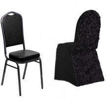 A black satin and spandex fitted chair cover on a black chair