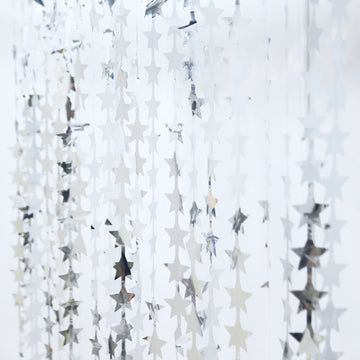 Create a Magical Atmosphere with the Metallic Silver Tinsel Streamer Backdrop