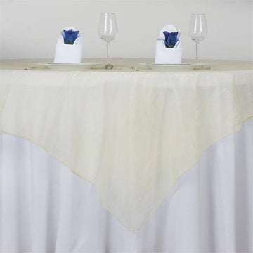 Elevate Your Event with the Champagne Organza Square Table Overlay