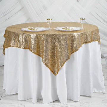 Add a Touch of Opulence to Your Event with the Gold Duchess Sequin Square Table Overlay 60"x60"