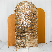 Fitted gold sequined backdrop covers sitting on a tiled floor