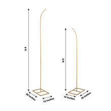 Backdrop stands made of metal in gold color with a curved top and sturdy rectangular base, measuring 20 inches and 18 inches