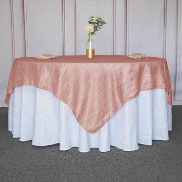 Create a Dreamy Atmosphere with the Dusty Rose Accordion Crinkle Taffeta Square Table Overlay