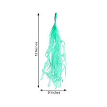 A teal tissue paper tassel with measurements of 12 inches and 6 inches, hanging with balloon & décor garlands