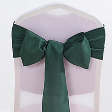 Polyester chair sashes in hunter emerald green color tied in a bow on a chair#whtbkgd