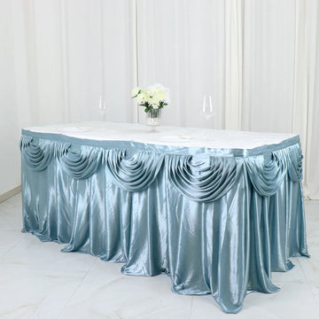 Elevate Your Event with the Dusty Blue Pleated Satin Double Drape Table Skirt