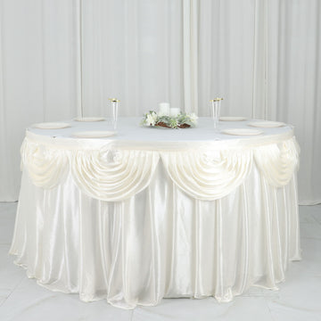 Create a Luxurious Atmosphere with the Ivory Pleated Satin Double Drape Table Skirt